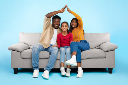 Symbolic Family Bond With Parents Creating a Protective Roof Over Their Daughterの写真素材