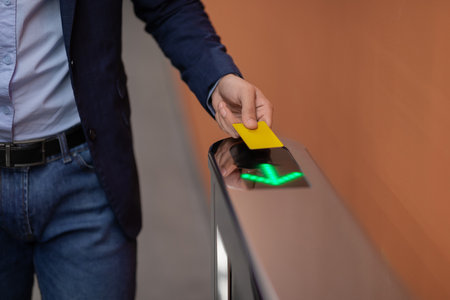 Man in Formal Outfit Using Electronic Entrance Gate Card at Office Security Checkpoint
