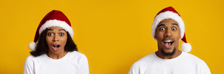 Joyful Couple Expressing Surprise During Christmas in Front of a Yellow Backgroundの写真素材