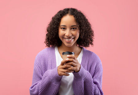 Young Black Woman Enjoying Takeaway Coffee With a Smile in a Studio Setting