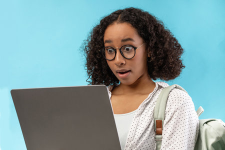 Shocked Student Discovers Missed Homework Deadline While Studying Onlineの写真素材