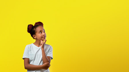 Young Girl Thinking Thoughtfully Against a Bright Yellow Background During Daytime