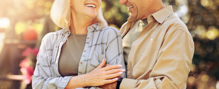 Couple Enjoys a Sunny Day Together While Sharing Smiles and Laughter Outdoors