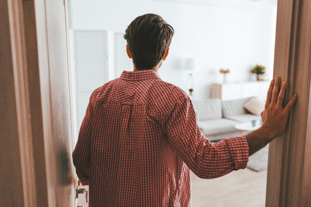 Man Entering a Living Room With a Relaxed Atmosphere in the Afternoonの写真素材