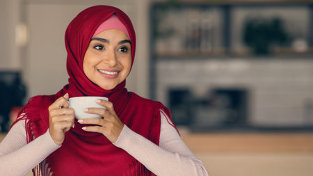 Woman Enjoying a Warm Beverage in a Cozy Cafe Setting With a Smileの写真素材