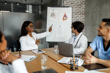 Cheerful black woman chief physician making presentation for international colleaguesの写真素材