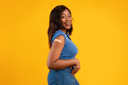 Black Young Woman Proudly Poses After Getting Vaccinated Against Covid-19の写真素材