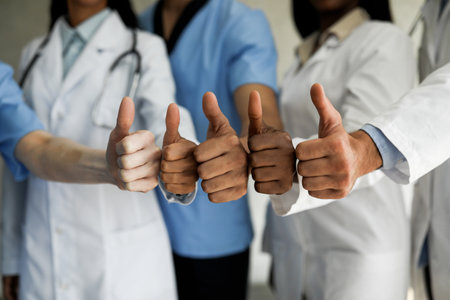 Unrecognizable multiracial group of doctors showing thumb upsの写真素材