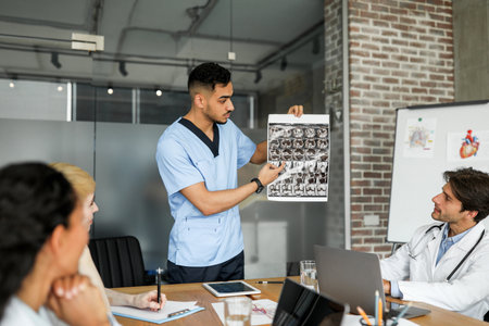 Middle eastern man doctor showing colleagues MRI scanの写真素材
