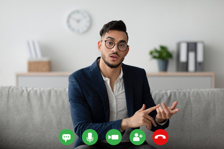 Arab Psychologist Conducting Online Consultations With Clients Through Video Chatの写真素材