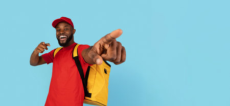 Delivery Service. Cheerful Black Courier Guy With Thermal Backpack Pointing At Cameraの写真素材