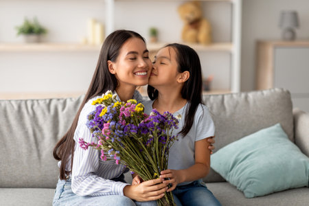 Sweet Moment Between a Daughter and Her Mom on a Special Day With Flowers and Loveの写真素材