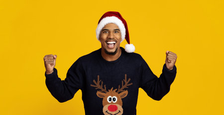 Excited Man Wearing a Reindeer Sweater and Santa Hat Celebrates Christmas Joyfullyの写真素材