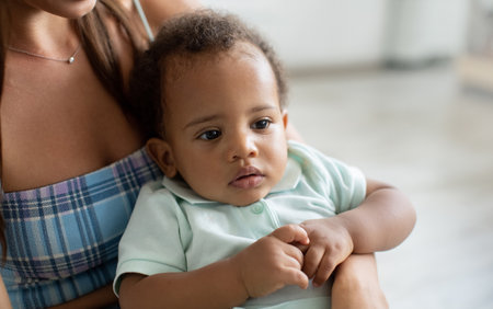 Mother and Baby Share Joyful Moments in Cozy Home Setting While Playing Togetherの写真素材