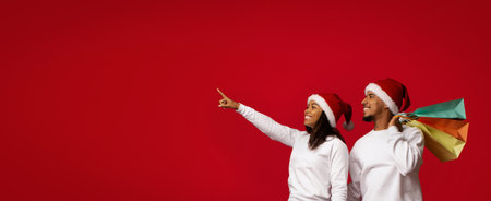 Couple Celebrating Christmas While Shopping and Pointing at a Festive Decorationの写真素材