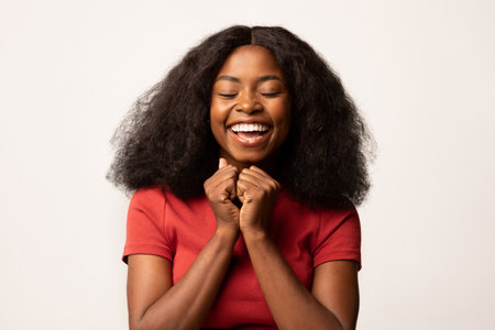 Delighted Young Black Lady Celebrating Pure Joy With Excitement and a Smileの写真素材