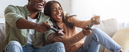 Couple Enjoying Video Game Session at Home in Cozy Living Room Setting With Laughterの写真素材