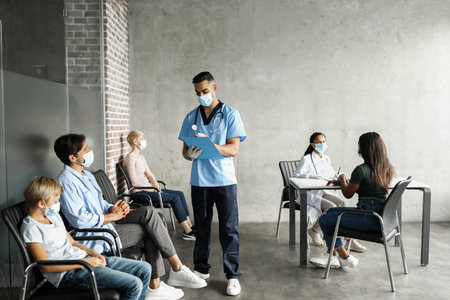 International group of patients waiting for vaccination at clinicの写真素材