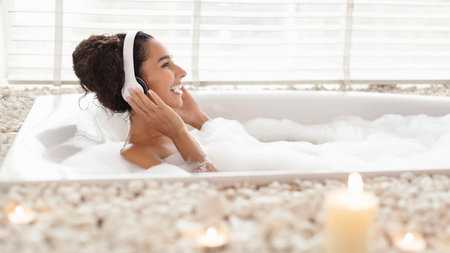 Relaxing Bath With Calming Music and Candles in a Bright, Modern Bathroom Setting