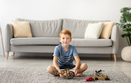 Cheerful Boy Enjoys Playtime With Helicopter and Cars in Cozy Living Room on a Sunny Dayの写真素材