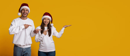 Cheerful Friends Celebrating Christmas With Festive Hats on Bright Yellow Backgroundの写真素材