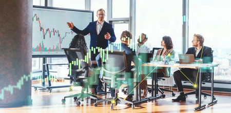 Businessman Leading Meeting in Modern Office With Financial Chart Displayedの写真素材