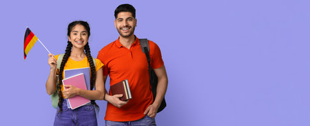 Students Celebrating Learning German With Books and a Flagの写真素材