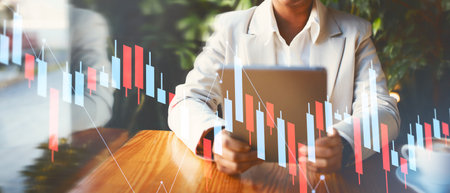Business Professional Analyzes Data Trends Using a Tablet in a Modern Office Environment