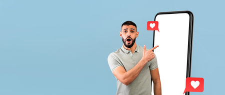 Man Excitedly Gestures Towards a Large Smartphone Screen With Social Media Icons