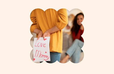 Child Surprises Mother With Handmade Note of Love in Cozy Living Roomの写真素材