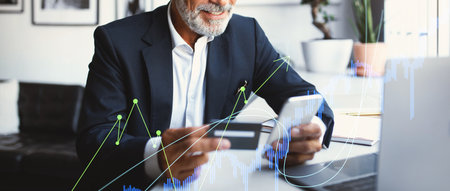 Senior Businessman Enjoys Modern Payment Method in Vibrant Office Environment