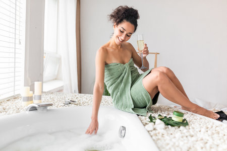 Relaxing Moment in a Spa With Bubbles and a Drink in Hand, Enjoying Tranquility and Self-Careの写真素材