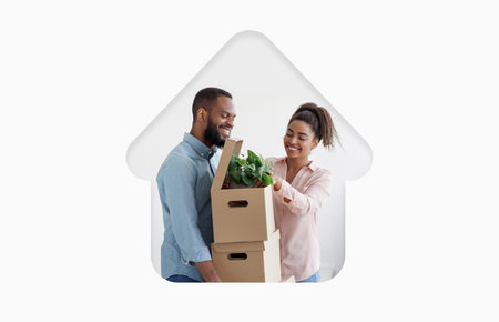 Couple Carrying Boxes and a Plant Into Their New Home During Daylight Hours