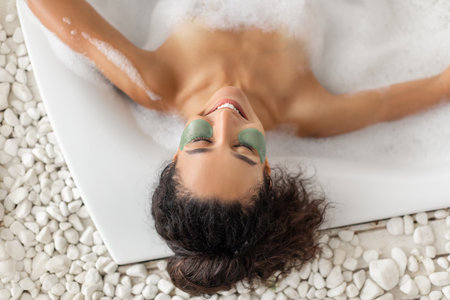 Relaxing Bath Experience With Mud Mask and Soothing Bubbles at a Spa Retreat
