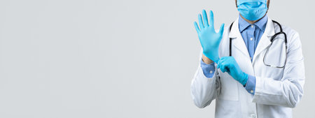 Medical Professional Preparing for Patient Care in a Clinical Setting During a Health Crisis