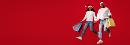 Happy Couple Celebrating Holidays With Festive Outfits and Shopping Bags Against Red Backgroundの写真素材