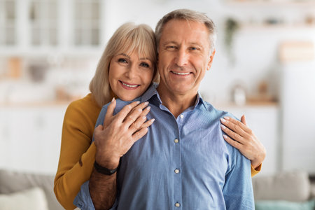 Happy Couple Enjoying Quality Time Together in Their Cozy Home Environment With Warm Smiles and...