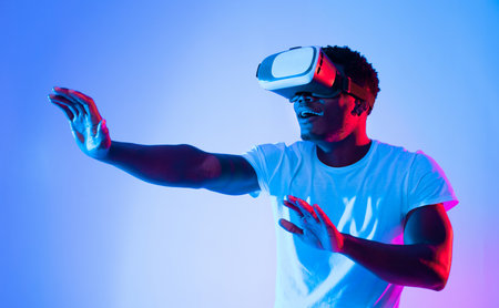Person Experiences Virtual Reality in Colorful Lighting Setting