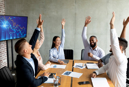 Successful Teammates Celebrate Achievements in Modern Boardroom Meeting
