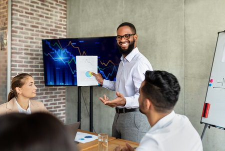 Black Male Entrepreneur Delivers Corporate Presentation Focused on Business Growth in Office Meeting