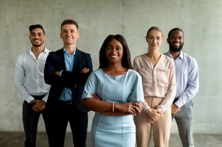 Multicultural Group of Business People With African American Female Leader Smiling Togetherの写真素材