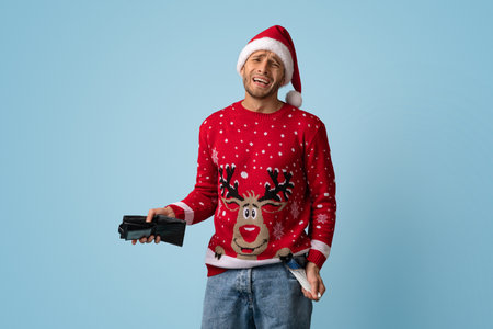 Man Dressed in a Festive Sweater and Santa Hat Holds Gifts While Expressing Mixed Emotions During a...