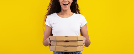 Excited Woman Holding Three Pizza Boxes in Front of a Bright Yellow Background