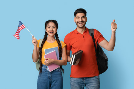 Excited Students Celebrate Cultural Exchange With Books and a Small American Flag on a Bright Blue...