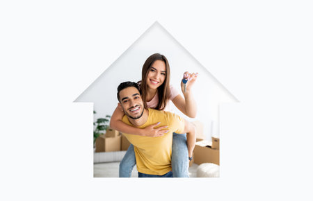 Happy Couple Celebrating New Home With Keys and a Smile in a Cozy Living Room