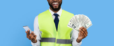 Person in Safety Vest Holds Cash and Phone With a Big Smile Against a Blue Background