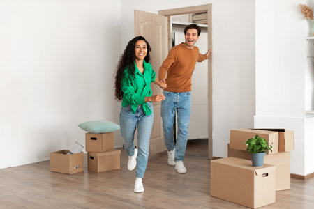 Excited Couple Joyfully Entering Their New Home Filled With Boxes and Possibilities
