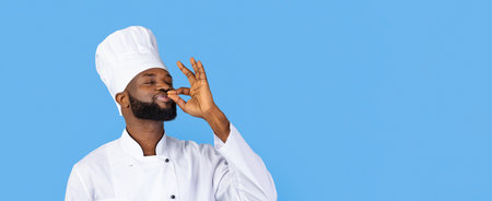 Chef Enjoying the Taste of Delicious Food While Posing Against a Blue Backgroundの写真素材