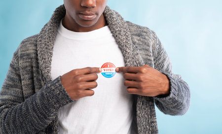 African american election voter wears I voted today pinの写真素材