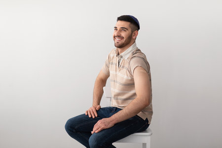 Jewish Man Showing Vaccinated Arm After Antiviral Injection, Studio Background